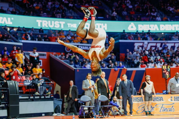Rich Township's Nasir Bailey does a flip after winning the Illinois Class 3A wrestling championship at 138 pounds.